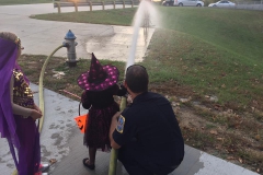 Kids play with firehose